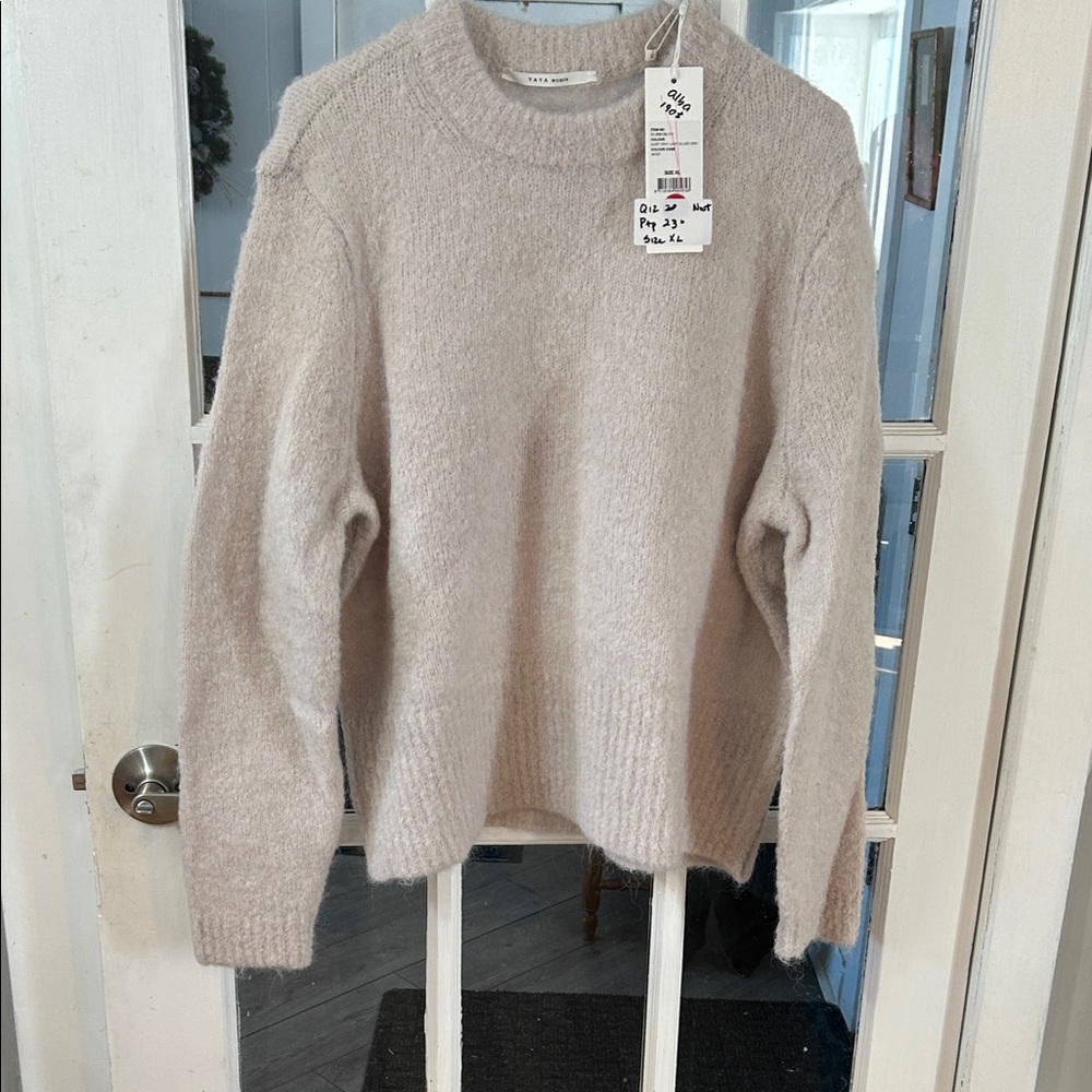 Q12.     Elegant Beige Crewneck Sweater